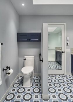 Accessible toilet area with support bar.