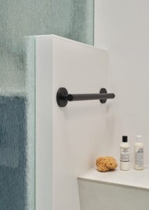 Step-in shower with bench and support bars.