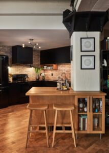 Cherry wood compact bar seating area and stools.