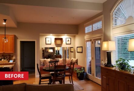 Black round kitchen table in a breakfast-nook.