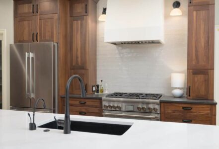 Custom plaster hood above a kitchen range.