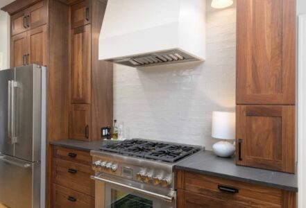 Custom plaster hood above a kitchen range.
