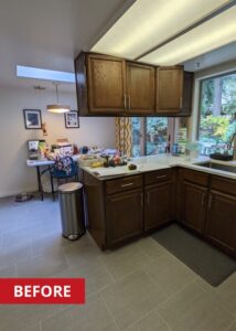 Kitchen with dark walnut cabinetry and a panel overhead light.