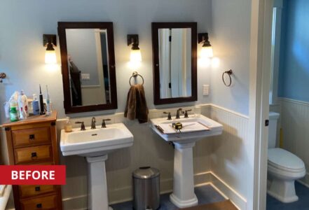 Two pedestal bathroom sinks next to each other in a primary bathroom.