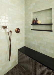Shower bench made from Daltile black penny tile.