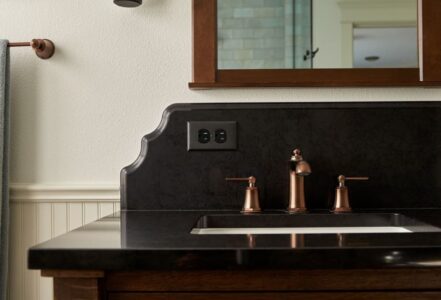 Cambria polished quartz vanity countertop in “Black Rock”.