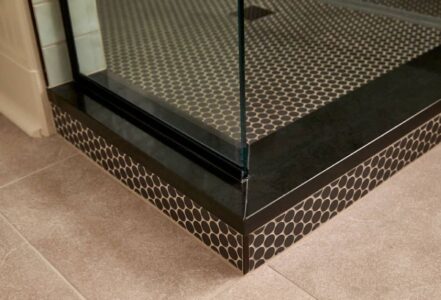 Black shower floor tile.