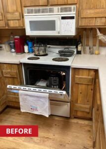 White four-burner electric stove and oven.