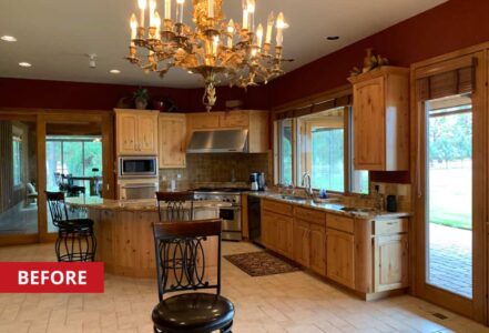 Kitchen with wooden cabinets and stainless steel appliances.
