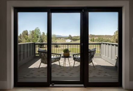 Sliding doors that lead to a patio sitting area.