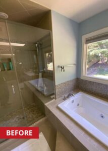 A step in shower to the left of a bathtub.