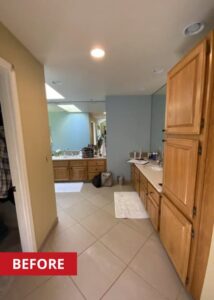 Hallway that leads from a bedroom to a primary bath.