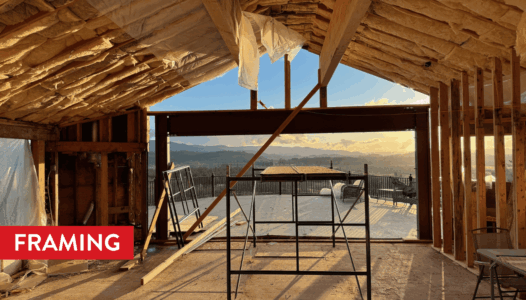 A large steel beam is installed for the oversized sliding glass door opening