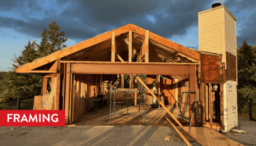 A large steel beam is installed for the oversized sliding glass door opening