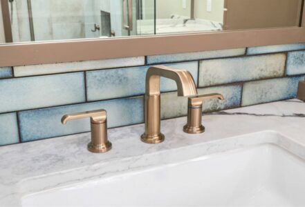 Brass Delta faucet and handles.