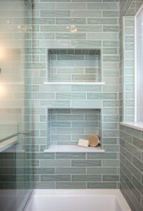 Extra deep shampoo niches in a remodeled shower