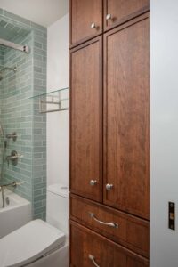 Cherry wood cabinets in a remodeled bathroom