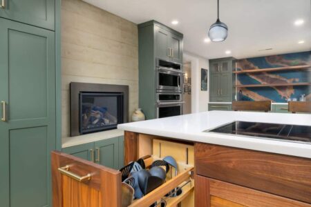 A remodeled kitchen with pull-out cabinet storage for cooking utensils