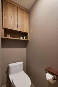 The separate toilet room of a remodeled primary bathroom
